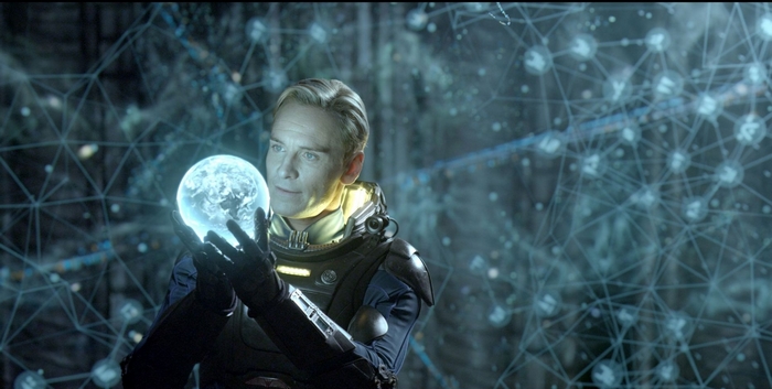 Michael Fassbender holding a glowing orb