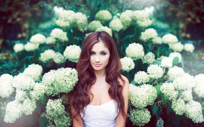 Woman in white dress with hydrangeas