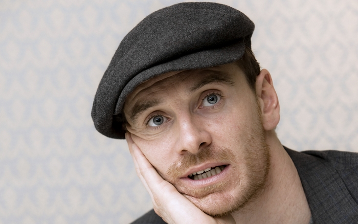 Michael Fassbender wearing a flat cap