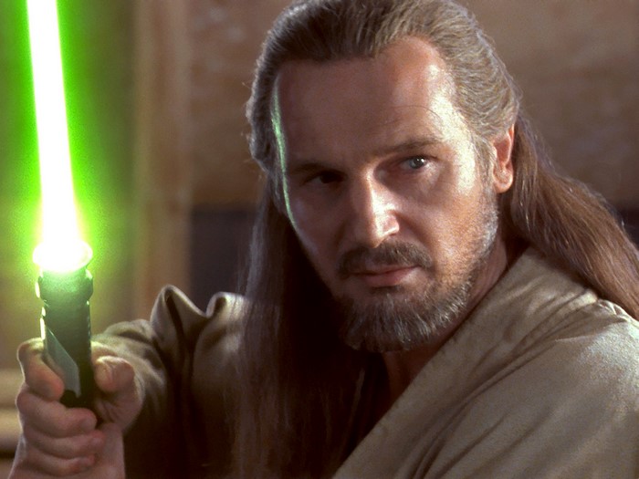 Qui-Gon Jinn from Star Wars holding a lightsaber