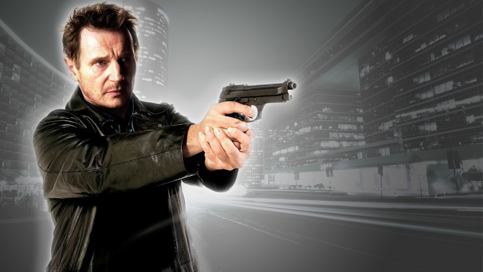 Liam Neeson holding a gun