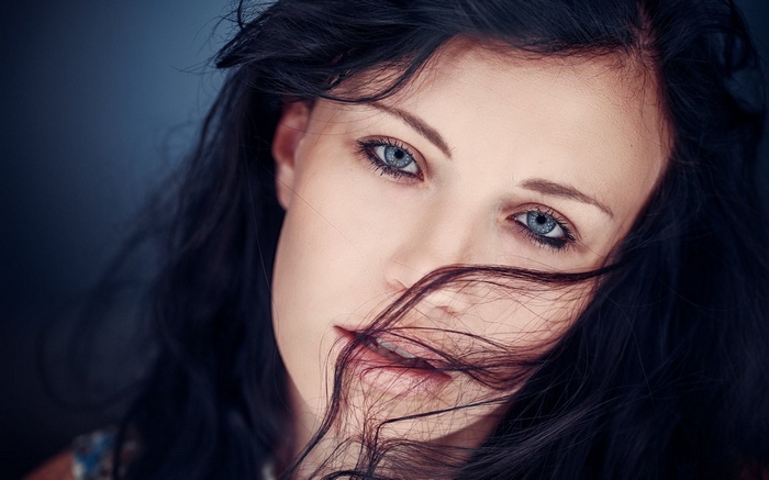 Close-up of a woman's face with dark hair