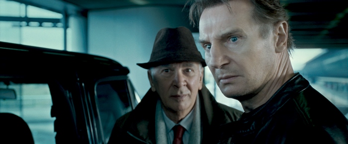 Liam Neeson and an older man in a car