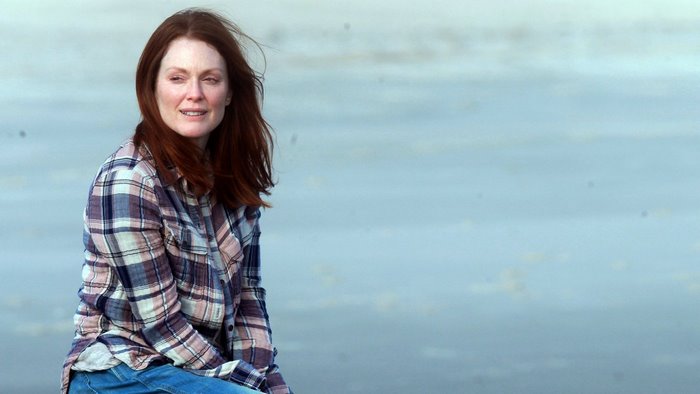 Julianne Moore sitting by the water