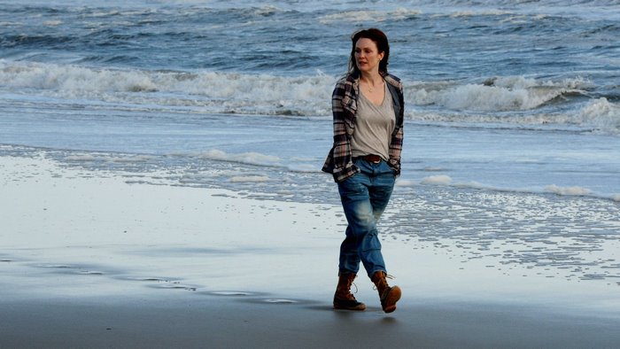 Julianne Moore walking on a beach
