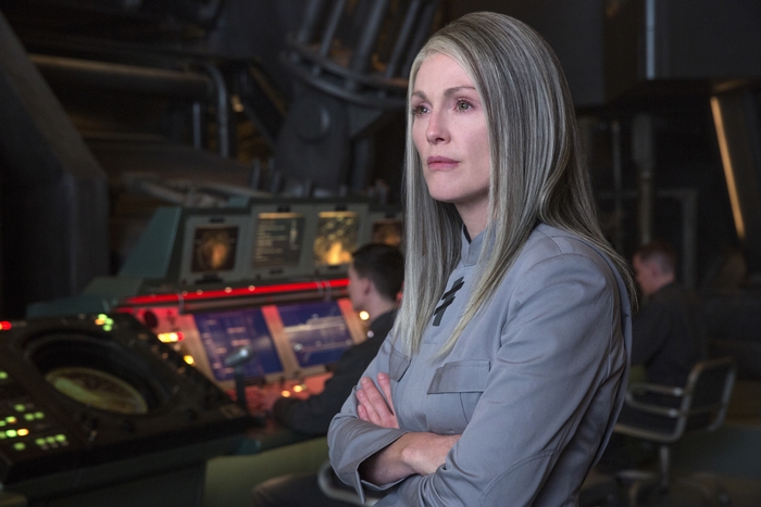 Julianne Moore in a futuristic control room
