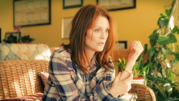 Julianne Moore sitting on a couch