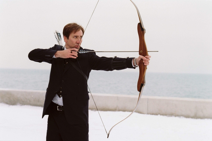 Nicolas Cage with a bow and arrow