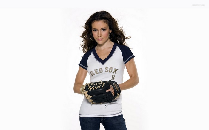 Alyssa Milano wearing a Red Sox shirt and baseball glove