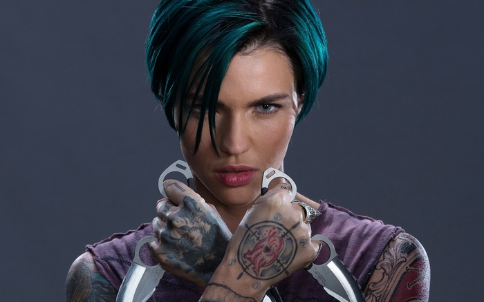 Ruby Rose holding knives