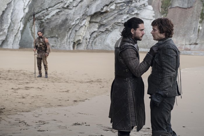 Theon and Jon Snow on a beach with a man in the background
