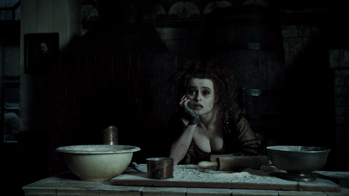 Helena Bonham Carter in a dark kitchen