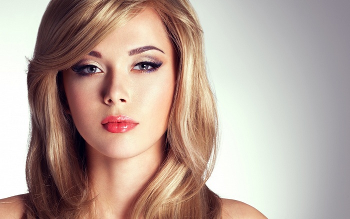 Woman with blonde hair and makeup