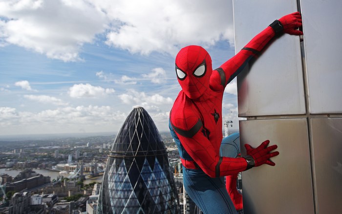 Tom Holland as Spider-Man on a building in London