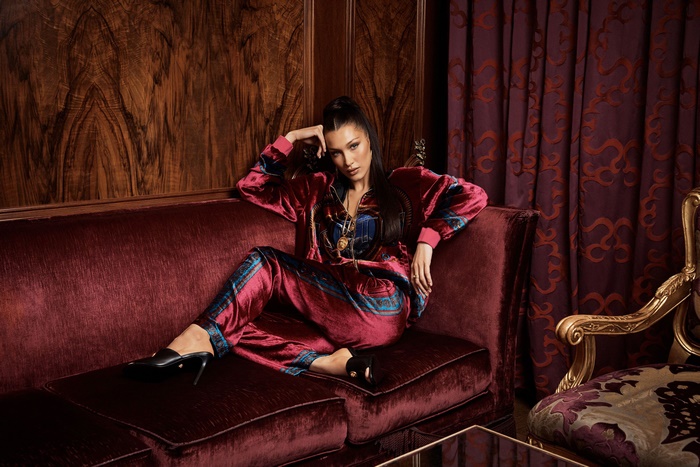 Bella Hadid in Luxurious Velvet Outfit on Sofa