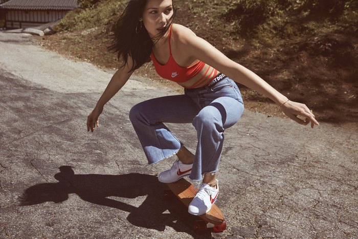 Bella Hadid skateboarding in jeans and Nike top