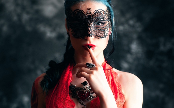 Woman in a black mask and red lace