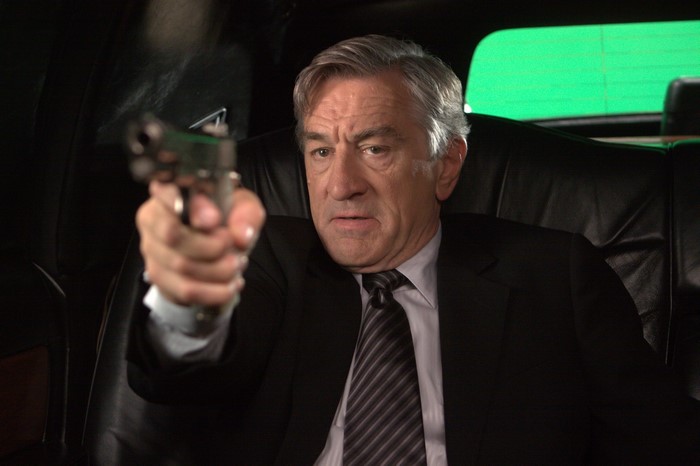 Robert De Niro holding a gun
