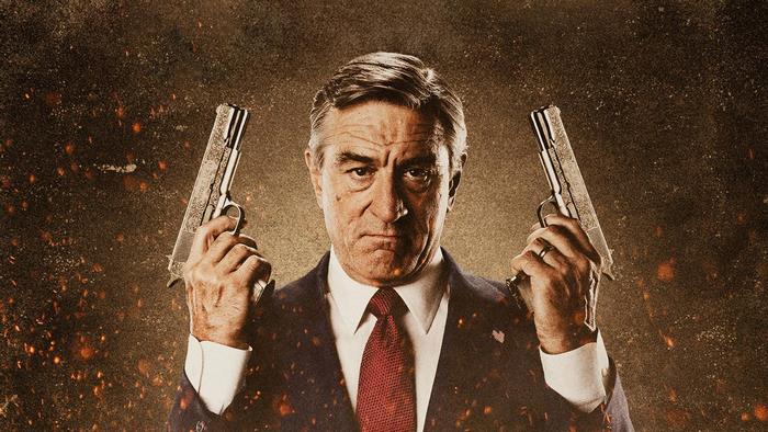 Robert De Niro holding two guns