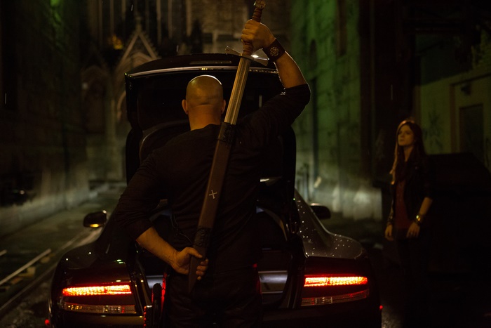 Rose Leslie with a sword and a car