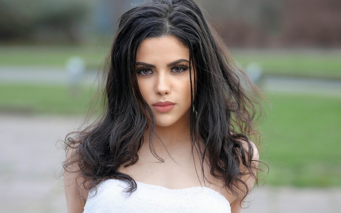 Woman in white strapless top outdoors
