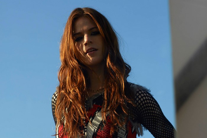 Rose Leslie against blue sky