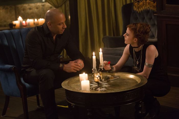 Vin Diesel and Rose Leslie in a dimly lit room