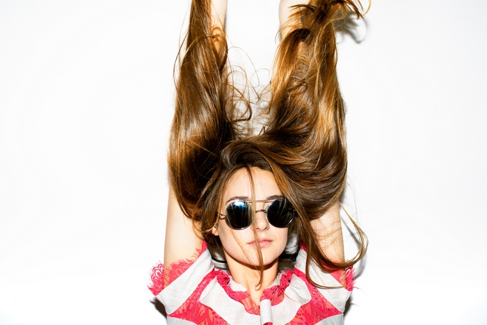 Shailene Woodley with long brown hair and sunglasses