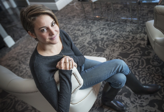 Shailene Woodley Sitting on Chair Smiling Cozy Room
