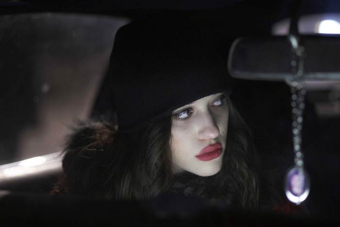 Kat Dennings in a car at night
