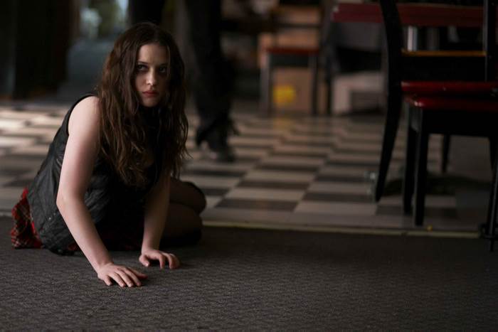 Kat Dennings on checkered floor