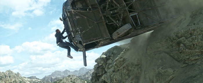 Paul Walker hanging from an overturned vehicle on a cliff