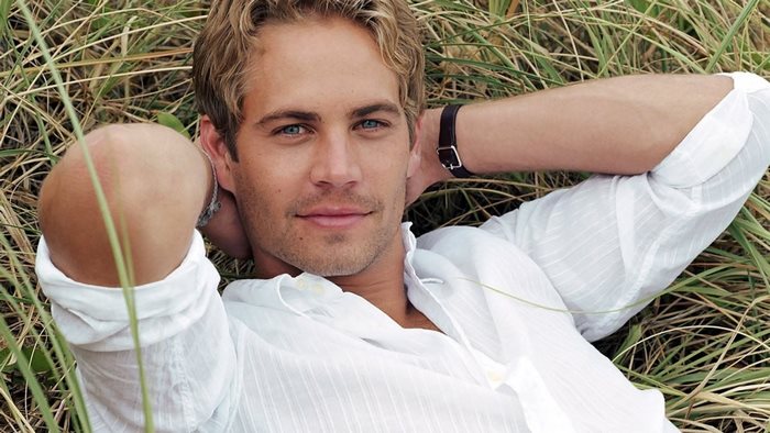 Paul Walker lying in grass