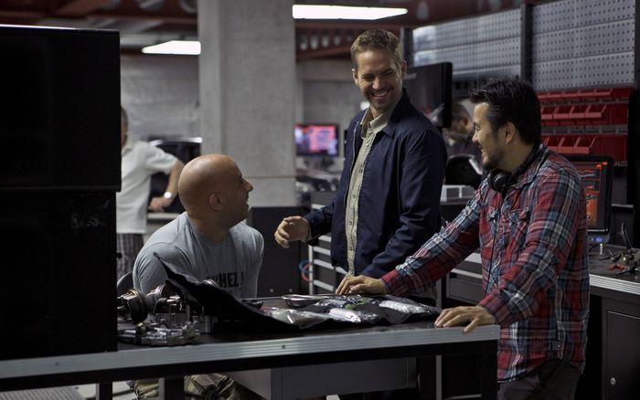 Paul Walker and Vin Diesel in a workshop