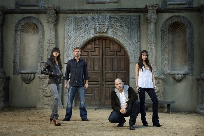 Fast & Furious cast in front of a building