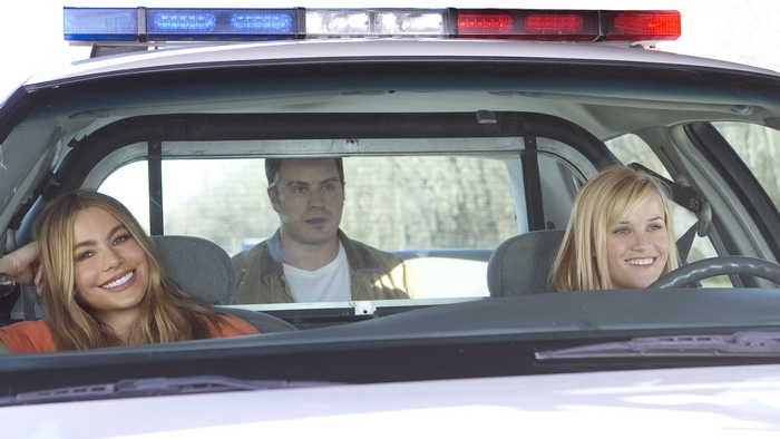 Sofia Vergara and Reese Witherspoon in a police car