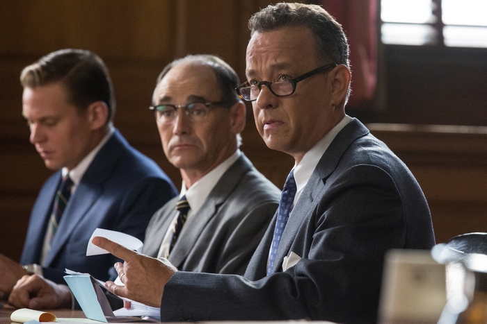 Tom Hanks and men in suits in courtroom