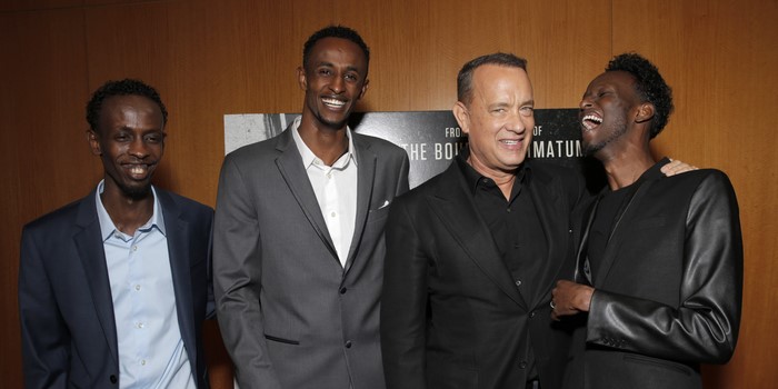 Tom Hanks with three men