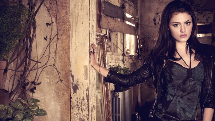 Phoebe Tonkin in a dark, rustic interior