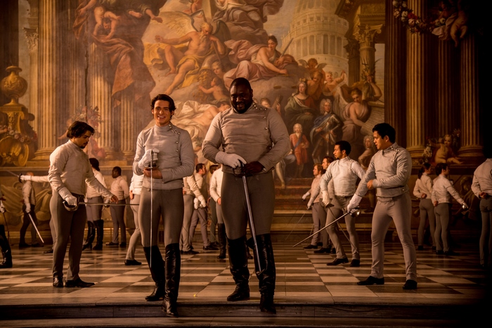 Richard Madden and other men in uniform with swords