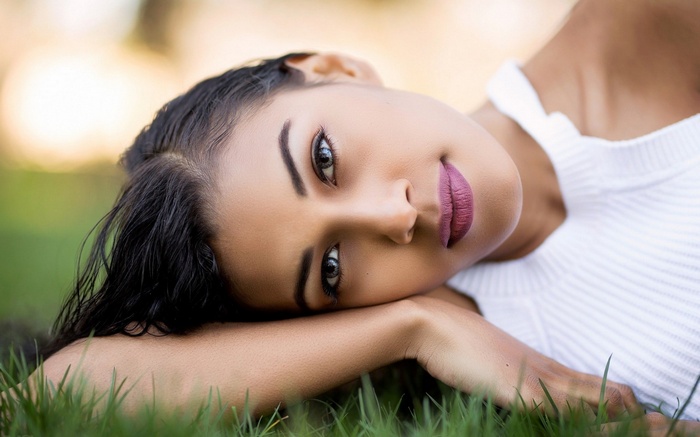 Woman lying on grass