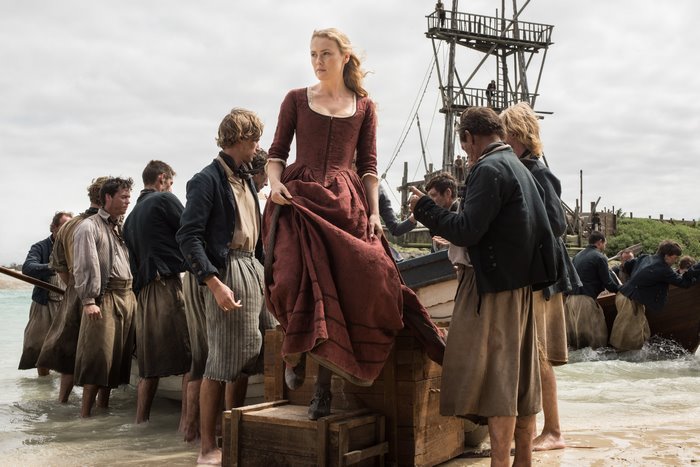 Hannah New on a boat with sailors
