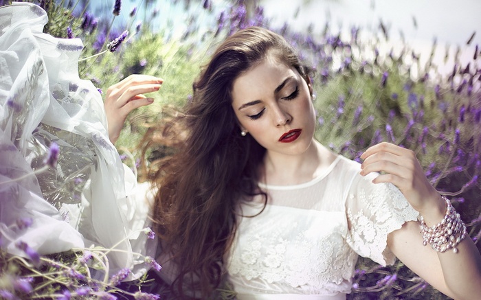 Woman in white dress in lavender field