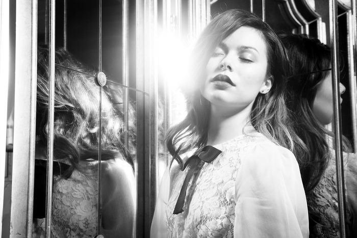 Miranda Cosgrove in a black and white portrait