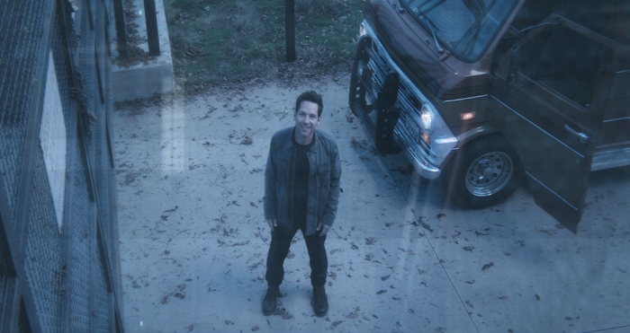 Paul Rudd standing next to a van