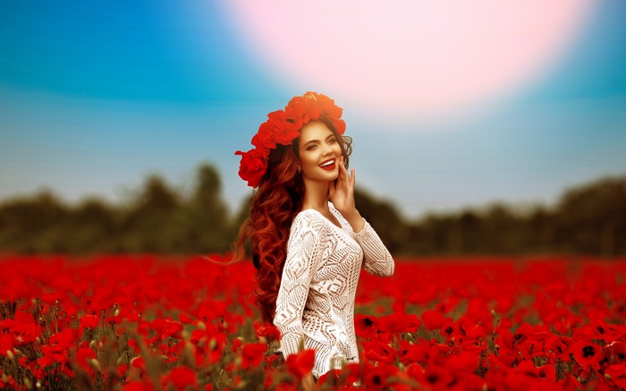 Woman with flower crown in poppy field