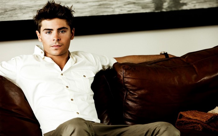 Zac Efron on a Leather Couch