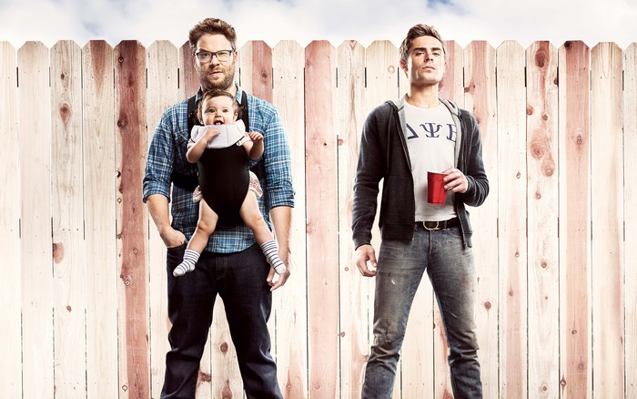 Seth Rogen and Zac Efron with a baby