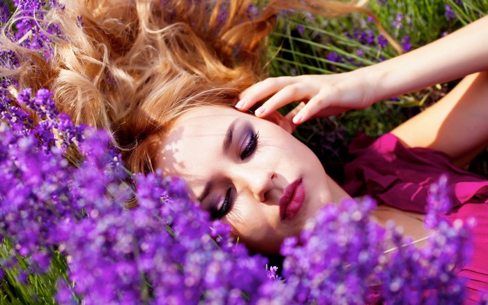 Woman lying in lavender field