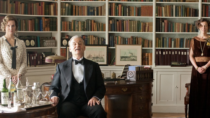 Bill Murray and two women in a library
